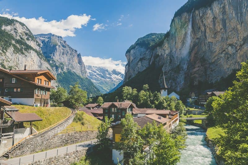 Alpine village and waterfall in Lauterbrunnen, Switzerland